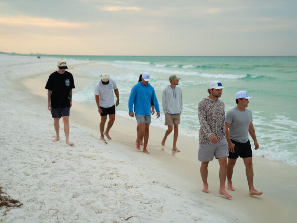 Top Sales Beach Trip 2026 – 14 Transcend team walking the beach at sunset