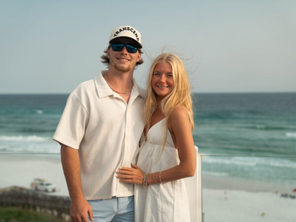 Top Sales Beach Trip 2026 – 17 Couple on the deck overlooking the ocean