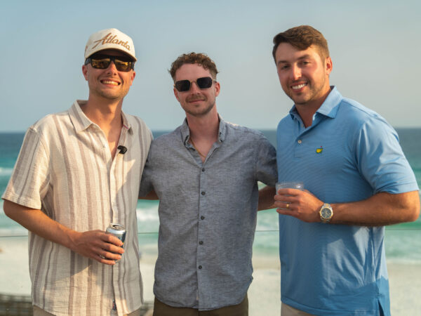 Top Sales Beach Trip 2026 – 20 Three team members on the oceanfront deck