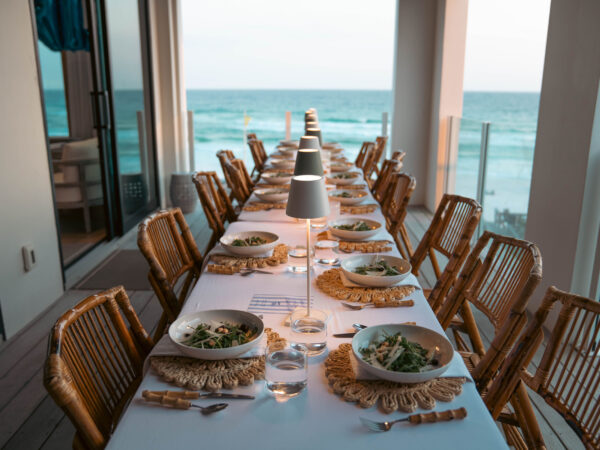 Top Sales Beach Trip 2026 – 21 Team dinner table set overlooking the ocean