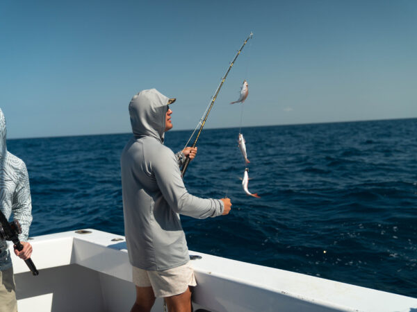 Top Sales Beach Trip 2026 – 23 Reeling in a catch on the fishing charter